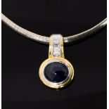 An 18ct yellow and white gold, collarette, set with an oval cabachon sapphire, diamond bale on,