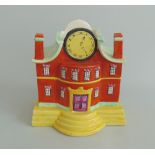 A Staffordshire pottery pastille burner of a clock house, decorated in bright yellow,