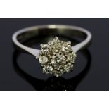 An 18ct white gold diamond flower head cluster, a total diamond weight of approx 0.