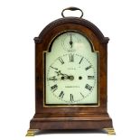 A George III mahogany bracket clock by Rolfe, Clerkenwell, arched case with brass swing handle,