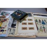 A folio containing toy theatre prints, some French period costumes,