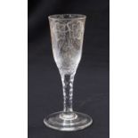 An 18th century ale flute, the elongated ogee bowl engraved with hops,