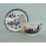 A Liverpool polychrome tea bowl and saucer,