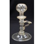 An 18th century glass lace-makers lamp, handled form with hollow knopped stem, folded foot,