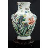 A Chinese famille verte vase on stand, of archaistic hu form, 19th century,