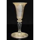 An 18th century wine glass,