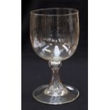 A large 18th century glass goblet or pedestal bowl, on a hollow knopped and splayed stem,