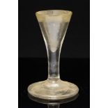 An 18th century toasting glass, the thick walled conical bowl on plain stem and conical foot, 9.