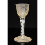 An 18th century opaque twist wine glass, the ogee bowl engraved with vine and bird,