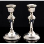 A pair of George VI silver baluster shaped desk candlesticks, W E Broadway & Co.