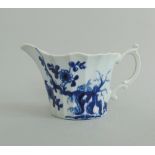 A small Worcester blue and white fluted cream boat, decorated with 'The Prunus Root' pattern,