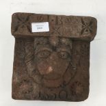 A mid 19th Century red sandstone gargoyle architectural capital, initials I.