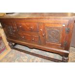 An early 20th Century oak carved sideboard,