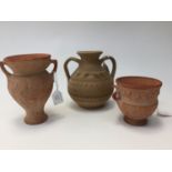 Three various Grecian reproduction urns,