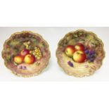 A pair of Royal Worcester cabinet plates, both signed H.