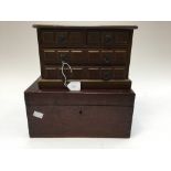 A mahogany box with maned brass plaque,