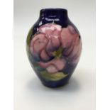 A small Moorcroft pink Magnolia vase