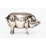 A silver pig pin cushion,