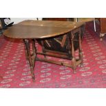 A 17th Century style oak joined gateleg table, plank top, turned legs, 71cm high, 114cm wide,