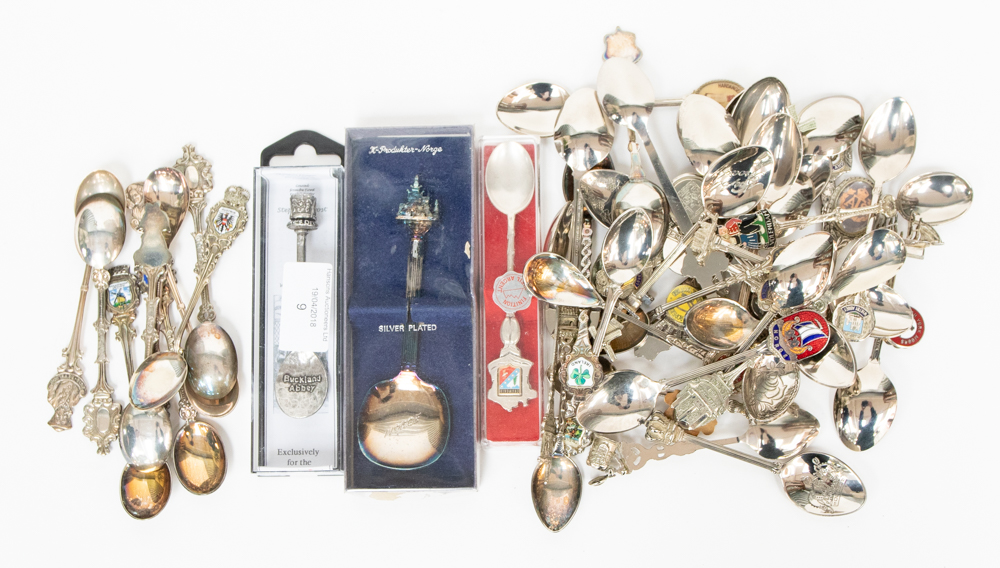 A collection of assorted souvenir spoons, including silver spoons of continental silver,