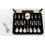 A 1925 circa boxed fruit/dessert (EPNS) cutlery set and a set of EPNS spoons with sugar tongs (2)