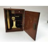 A cased brass microscope, Morgan Optician Manchester, with extra lenses ,