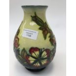 A Moorcroft tube lined trial vase, signed by the artists,