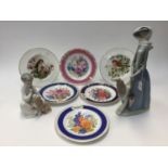 A Lladro figure of lady and another Lladro figure of a child with puppy and six plates,