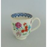 A Worcester Polychrome Coffee Cup, Decorated with a Floral Spray and Blue inside rim border,