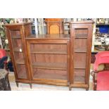 A French 19th Century elm grill fronted bookcase, of inverted breakfront form,