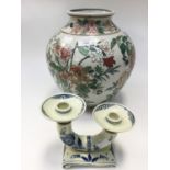 An Oriental vase together with a Delft ware twin candlestick (2)