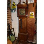 An oak longcase clock with brass dial by William Wilkes-Wolverton