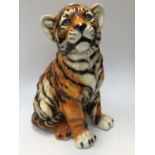 A large ceramic tiger cub,