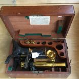 A Swift and Son brass and lacquered monocular microscope, first half of the 20th Century,