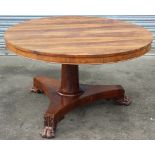 A 19th Century rosewood tilt top pedestal breakfast table, the top with book-matched veneers,