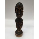 An African tribal carved wood figure, late 19th Century, early 20th Century, approx 25cms high,