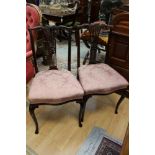 A pair of Edwardian mahogany parlour chairs, in the Chippendale manner, pierced back splats,