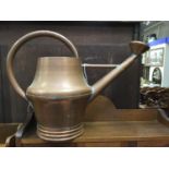 A large copper watering can, possibly 19th Century, having C handle and detachable rose,