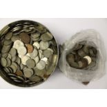 A tin and bag of coins (2)