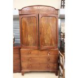 A George III mahogany linen press, the upper section with two doors,