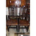 A pair of Victorian oak carved hall chairs,