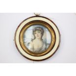 ***PLEASE NOTE AMENDED GUIDE*** A circular portrait miniature, British School, early 19th Century,