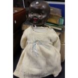 Restoration project - a black baby doll, opening and closing eyes, lower limbs missing,