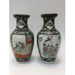 A pair of Chinese baluster vases, one has crack,