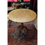 A George III oak tilt top tripod table, 70cm high,