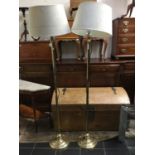 A pair of brass standard lamps with chased design (2)