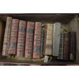 A small selection of 19th century books housed in vintage leather suitcase,