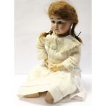 A Limoges French bisque head doll with open mouth,