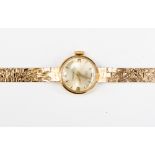 A 9ct gold ladies wristwatch with a gold bracelet chain, 16 grams approx,