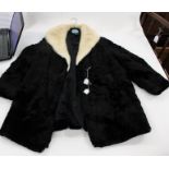 A black moleskin ladies jacket 1940s style having a cream mink collar (some splits in the pelts)